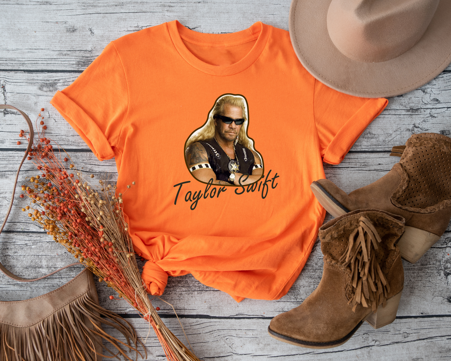 Combine your fandoms of Taylor Swift and Dog the Bounty Hunter with this delightful tee.
