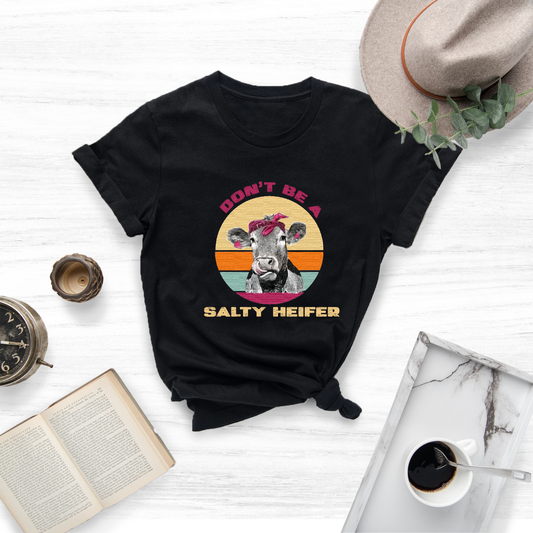 Own your sassy attitude with this delightful "Don't Be A Salty Heifer" tee.