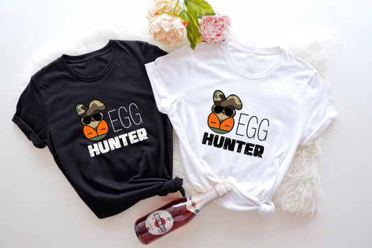 Embrace the true spirit of Easter and celebrate the joy of the resurrection with our unique "Egg Hunter Easter Bunny" T-Shirt.
