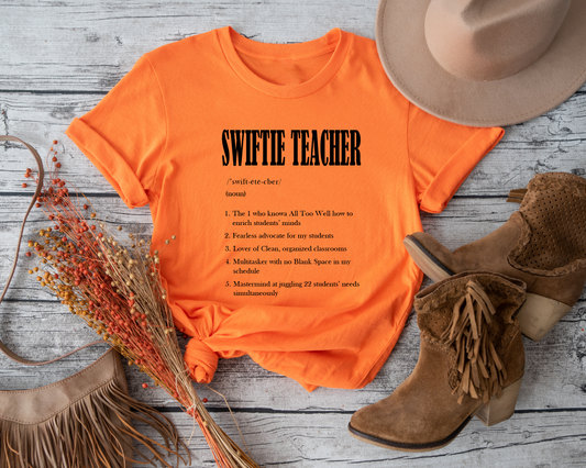 Showcase your individuality and love for Taylor Swift and teaching Add a touch of personality and style to your teaching attire Enjoy the comfort and style of a high-quality graphic tee Makes a perfect gift for any teacher who is also a Swiftie