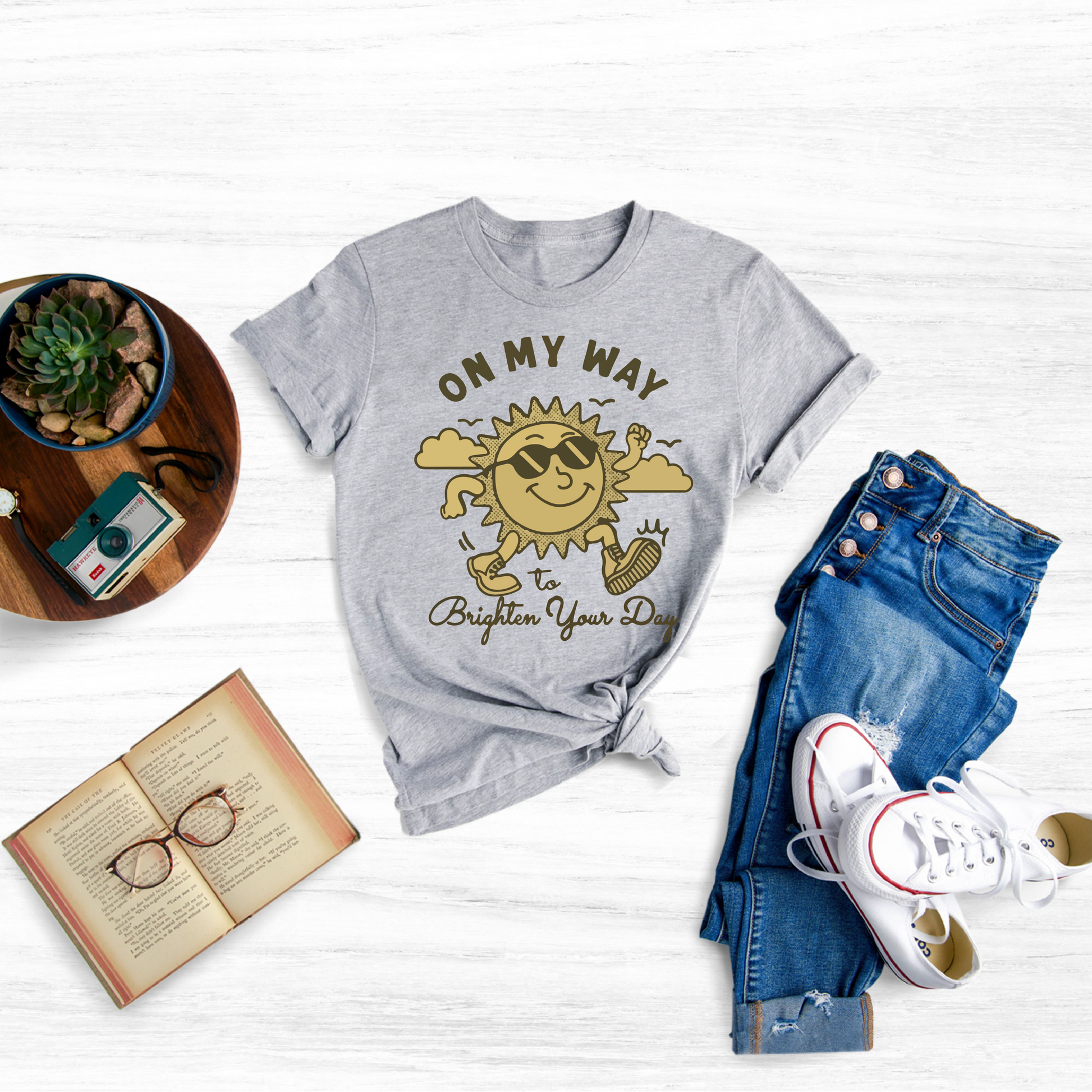 Spread a little sunshine wherever you go with our "Shirt On My Way To Brighten Your Day" T-Shirt, the perfect way to add a touch of positivity and cheer to your everyday wardrobe.