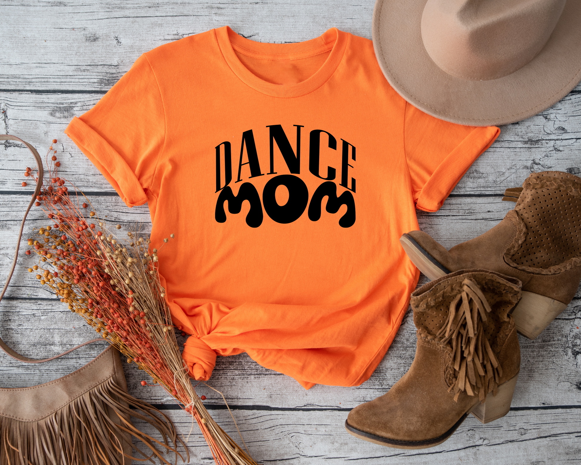"Shirt showcasing the pride and enthusiasm of dance moms who support their children's passion."