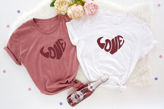 A vibrant Valentine's Day shirt featuring a classic retro heart design and love-themed message.