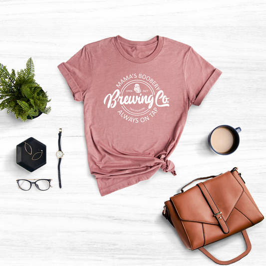Shirt featuring a humorous take on breastfeeding: 'Mama's Boobery Always on Tap Brewing Co
