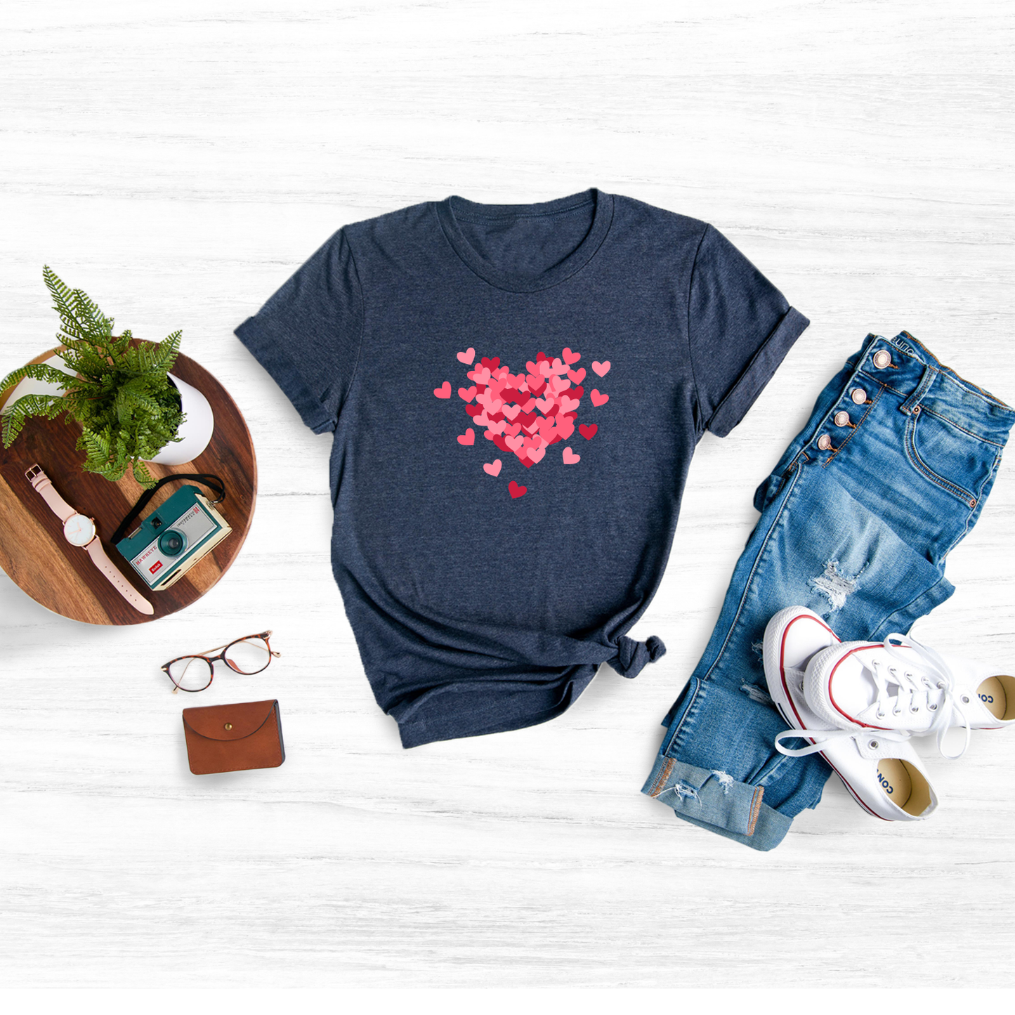 Celebrate love and femininity with this unique and eye-catching double heart tee.