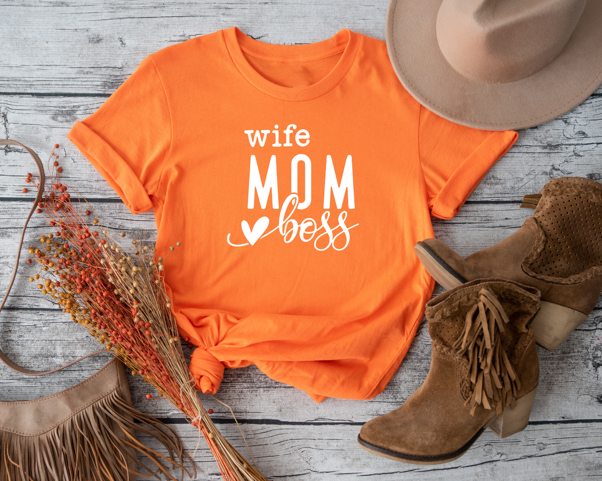 T-shirt with a bold message: 'Mom Wife Boss' for women who juggle it all." 